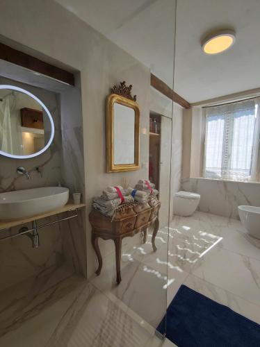 a bathroom with a sink and a mirror at Natura e Arte in Pavullo nel Frignano