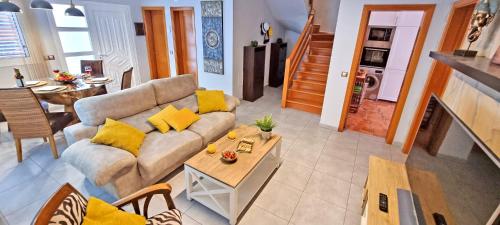 a living room with a couch and a table at CASA BALIMAR in Tarajalejo