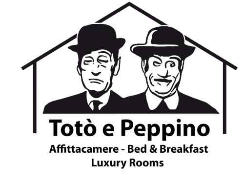 two men in hats in a house logo at Toto e Peppino Luxury Rooms in Naples