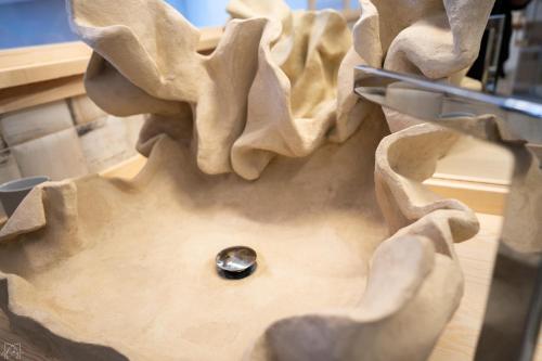 a button in the middle of a piece of dough at Hotel Don Marcos in Osma
