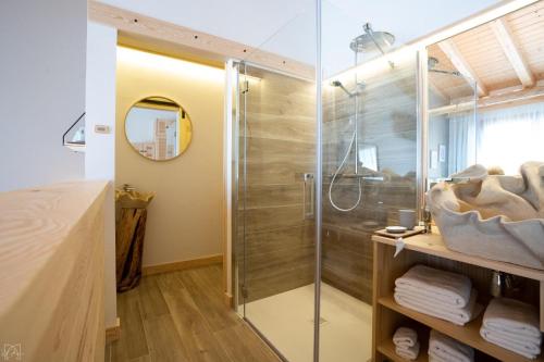 a shower in a bathroom with a glass shower stall at Hotel Don Marcos in Osma