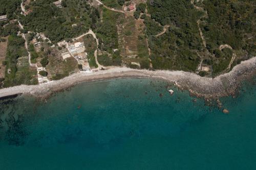 an aerial view of a beach and the ocean at Villa Renata & Villa Filippos with private Plunge Pool by Konnect in Agios Gordios