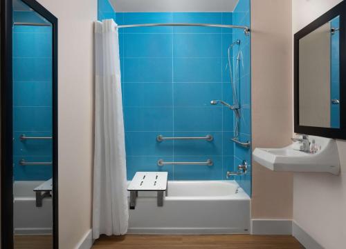 a bathroom with a tub and a toilet and a sink at Motel 6-Santa Barbara, CA - Beach in Santa Barbara