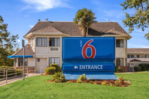 a sign in front of a house at Motel 6-Fairfield, CA - North in Fairfield