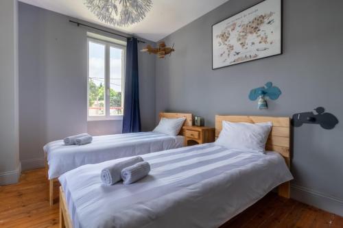 Posteľ alebo postele v izbe v ubytovaní Maison du Grichet - Piscine privée