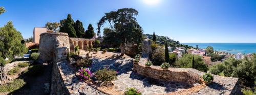 a large stone building with a view of the ocean at Soho Boutique Castillo de Santa Catalina - Adults Recommended in Málaga