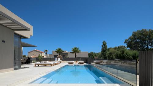 Athina Luxury Villa, with Pool & Walk to the Beach, By ThinkVilla