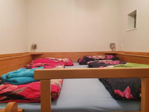 Una cama o camas en una habitación de Höss-Alpin-Lodge