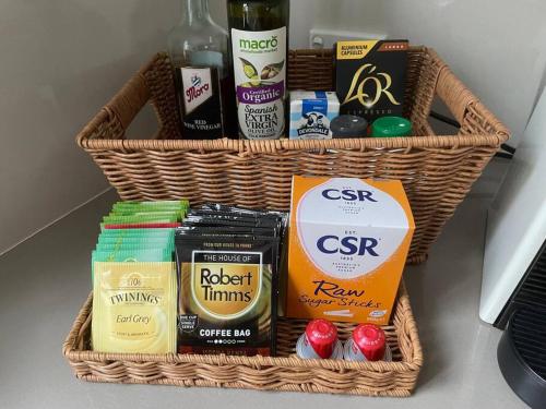 two baskets filled with different types of food and drinks at Phegans Bay Waterfront Retreat in Blackwall