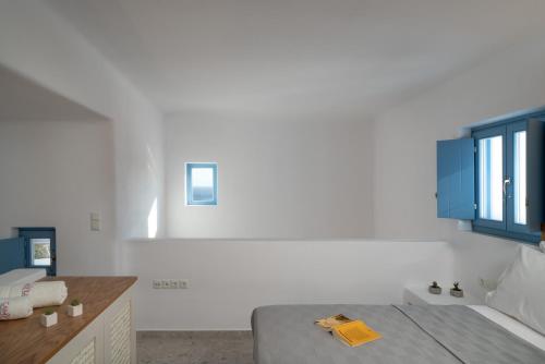 Postel nebo postele na pokoji v ubytování Camvillia Donoussa Village Suites