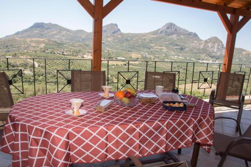 a table with a red and white checkered table cloth at Villa Erofili Plakias south Rethimno Crete in Asómatoi