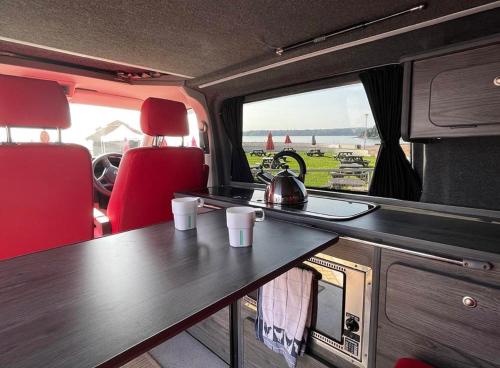 a table in the back of an rv with cups on it at ChillDayz in Paignton