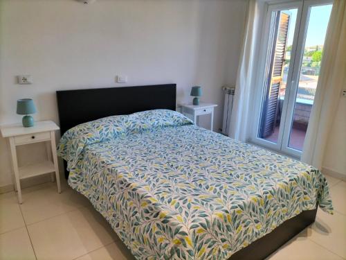 Ένα ή περισσότερα κρεβάτια σε δωμάτιο στο THE HOUSE FIERA di ROMA AEROPORTO FIUMICINO