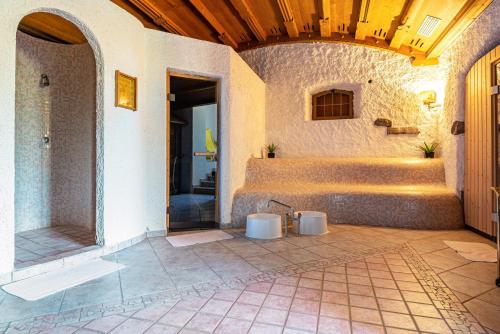 a bathroom with two urinals in a building at Ferienparadies Sabina Piz in Alpe di Siusi