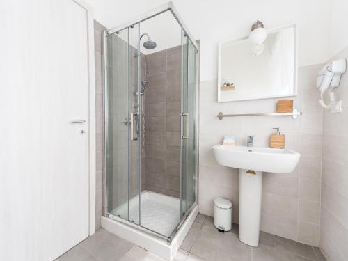 a bathroom with a shower and a sink at Blunotte Torino - Piazza Arbarello in Turin