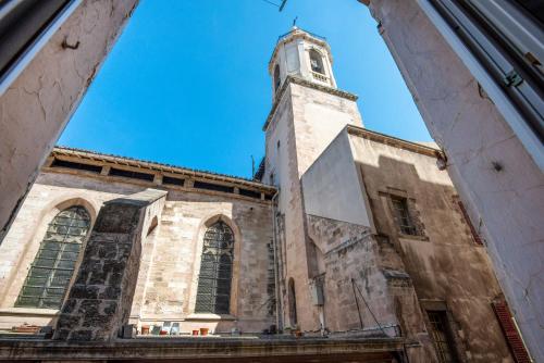 a building with a clock tower on top of it at Le Balcon du Vieux-Port-Amazing Sea View-100m2 in Marseille