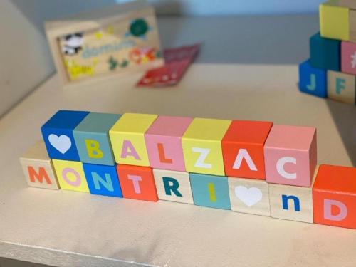 a toy block with the words baby on a table at Bel Air - Propriétés Mont Amour in Montriond