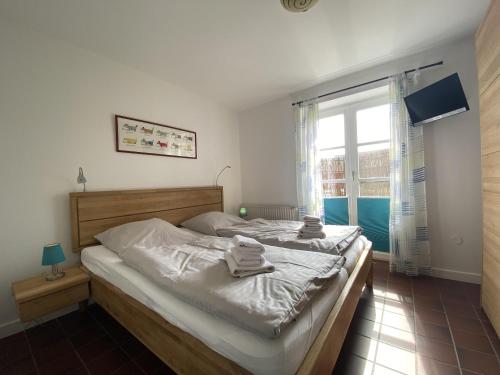 Postel nebo postele na pokoji v ubytování Doppelhaushälfte Strandhus