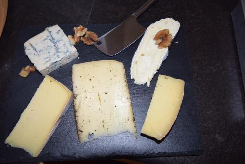 a bunch of different types of cheese on a plate at Auszeit Filzmoos in Filzmoos