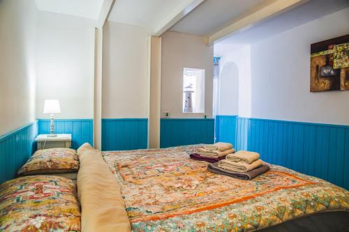 a bedroom with a bed with two pillows on it at Casa el Mar apartamento El Faro in Güimar