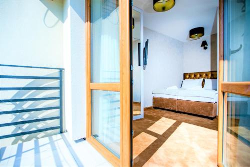 Ένα ή περισσότερα κρεβάτια σε δωμάτιο στο Amber Park Spa