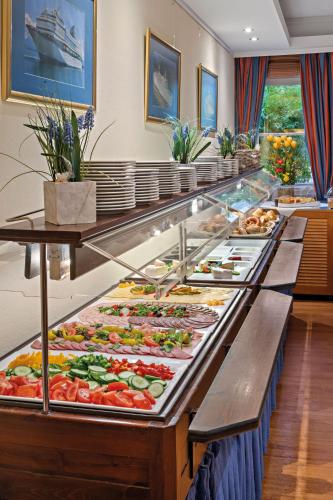 a buffet line with many different types of food at Hotel Juwel in Bad Füssing