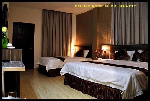 Katil atau katil-katil dalam bilik di K Garden Hotel (BS)