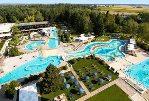 an aerial view of a water park with several pools at Hotel Juwel in Bad Füssing