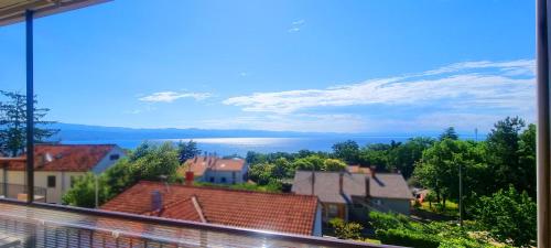 a view of the water from a city at Apartments Skorup in Ičići