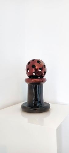 a brown and black object sitting on top of a table at Sea Lilies Suites in Plaka