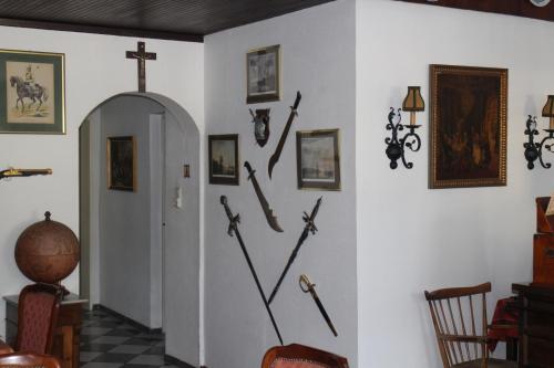a wall with crosses and swords on a wall at Hotel an der Fähre in Sankt Goar