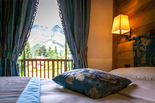 Posteľ alebo postele v izbe v ubytovaní Hotel Lo Scoiattolo