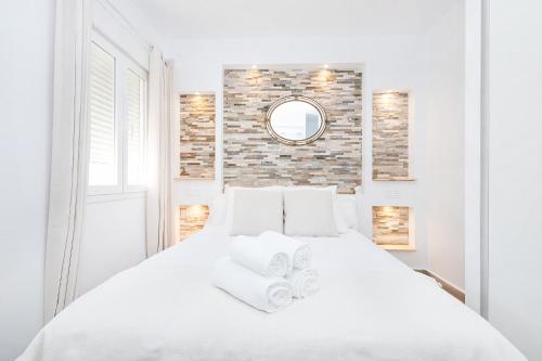 Postel nebo postele na pokoji v ubytování Marmoles 21, City Center Apartment