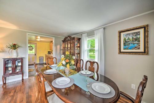 a dining room with a table and chairs at Cheerful Grand Rivers Cottage, half Mi to Lake in Grand Rivers