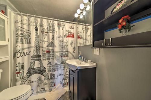 a bathroom with a shower curtain with the eiffel tower at Cheerful Grand Rivers Cottage, half Mi to Lake in Grand Rivers
