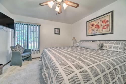 a bedroom with a bed and a ceiling fan at Cozy West Bloomfield Home - Fishing Nearby! in West Bloomfield