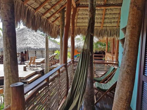 a hammock on the deck of a resort at Terra Patris in Barra Grande