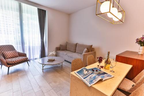 a living room with a couch and a table at Royal Montesun Apartments in Budva