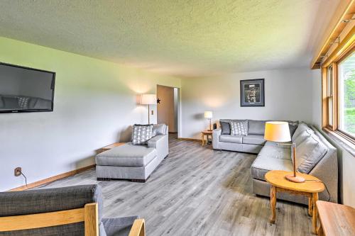 a living room with two couches and a tv at Stunning Wisconsin Retreat on Active Farm! in Spring Green