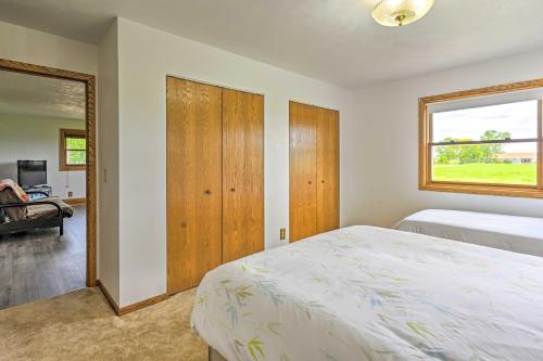a bedroom with a bed and a window at Stunning Wisconsin Retreat on Active Farm! in Spring Green