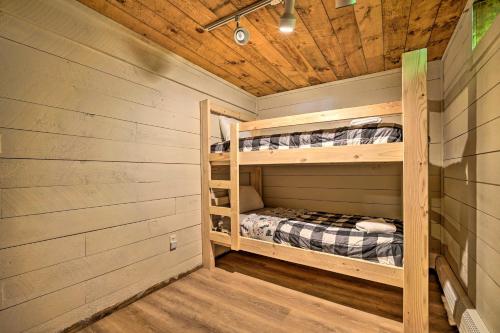 a log cabin with two bunk beds in it at Wilmington Chalet with Hot Tub Less Than 8 Mi to Mount Snow! in Wilmington