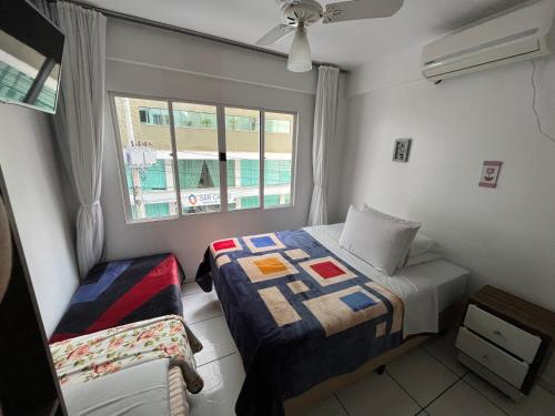 Giường trong phòng chung tại Residencial Dubai Centro