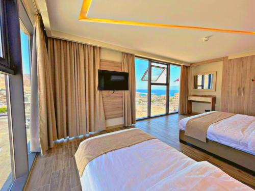TV a/nebo společenská místnost v ubytování ALENA HOTEL