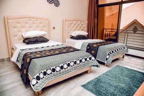 Ένα ή περισσότερα κρεβάτια σε δωμάτιο στο Nziza View Hotel