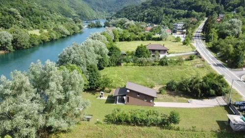 an aerial view of a house next to a river at House Legacy in Bihać