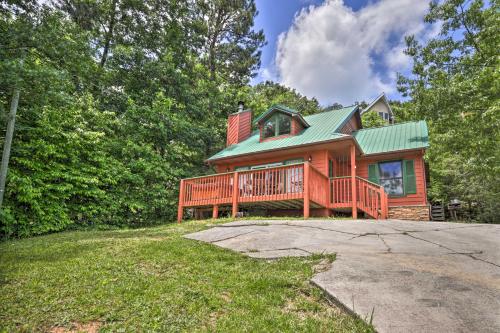 a large wooden house with a green roof at Gatlinburg Chalet Hot Tub, Sauna and Mountain View in Gatlinburg