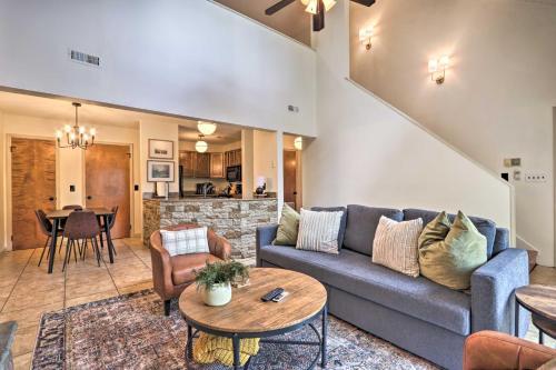 a living room with a couch and a table at Gatlinburg Chalet Hot Tub, Sauna and Mountain View in Gatlinburg