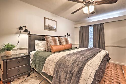 a bedroom with a bed and a ceiling fan at Gatlinburg Chalet Hot Tub, Sauna and Mountain View in Gatlinburg