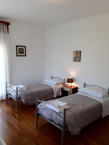 Postel nebo postele na pokoji v ubytování EasyRoom Piovene Rocchette
