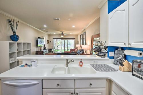 a kitchen with a sink and a counter top at Waterfront Palm Coast Condo with Boat Dock and Pool! in Palm Coast